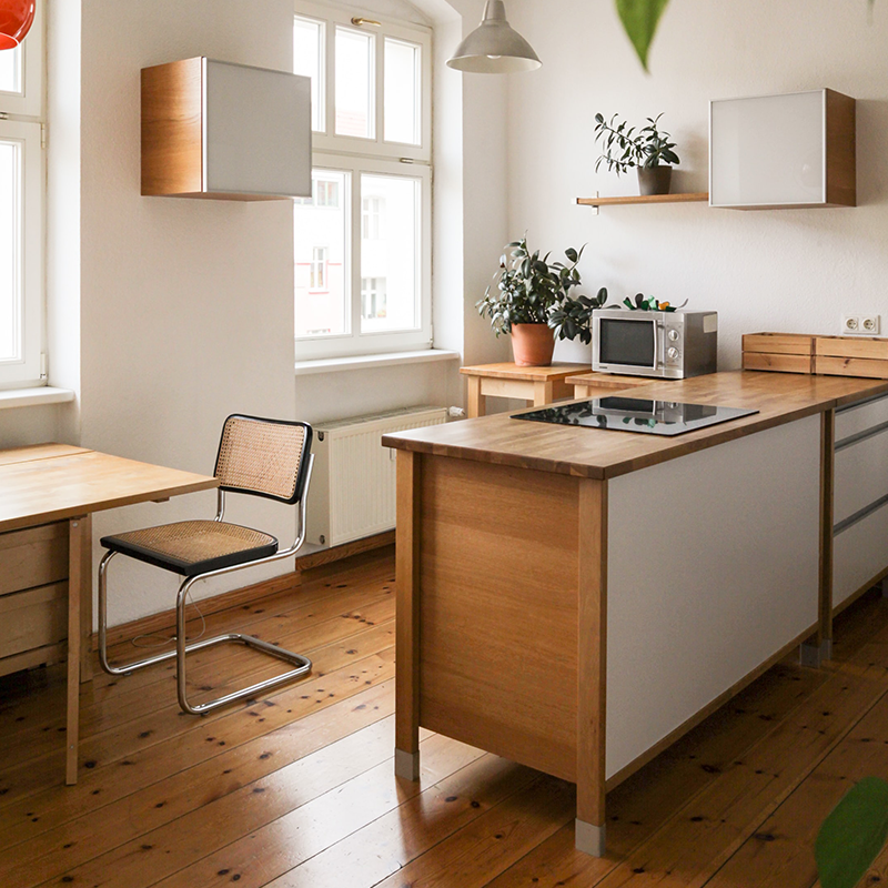 Modern Kitchen with a Butcher Block Countertop Cooking Island