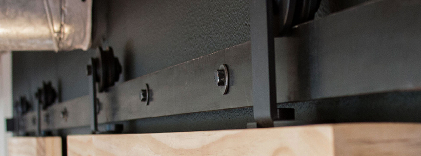 Black Aero Sliding Hardware on bi-parting barn door operation