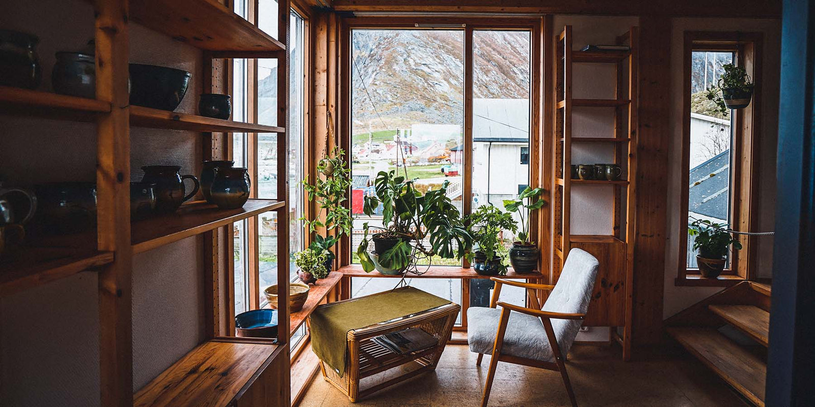 serenity room space with a blue chair facing a large window