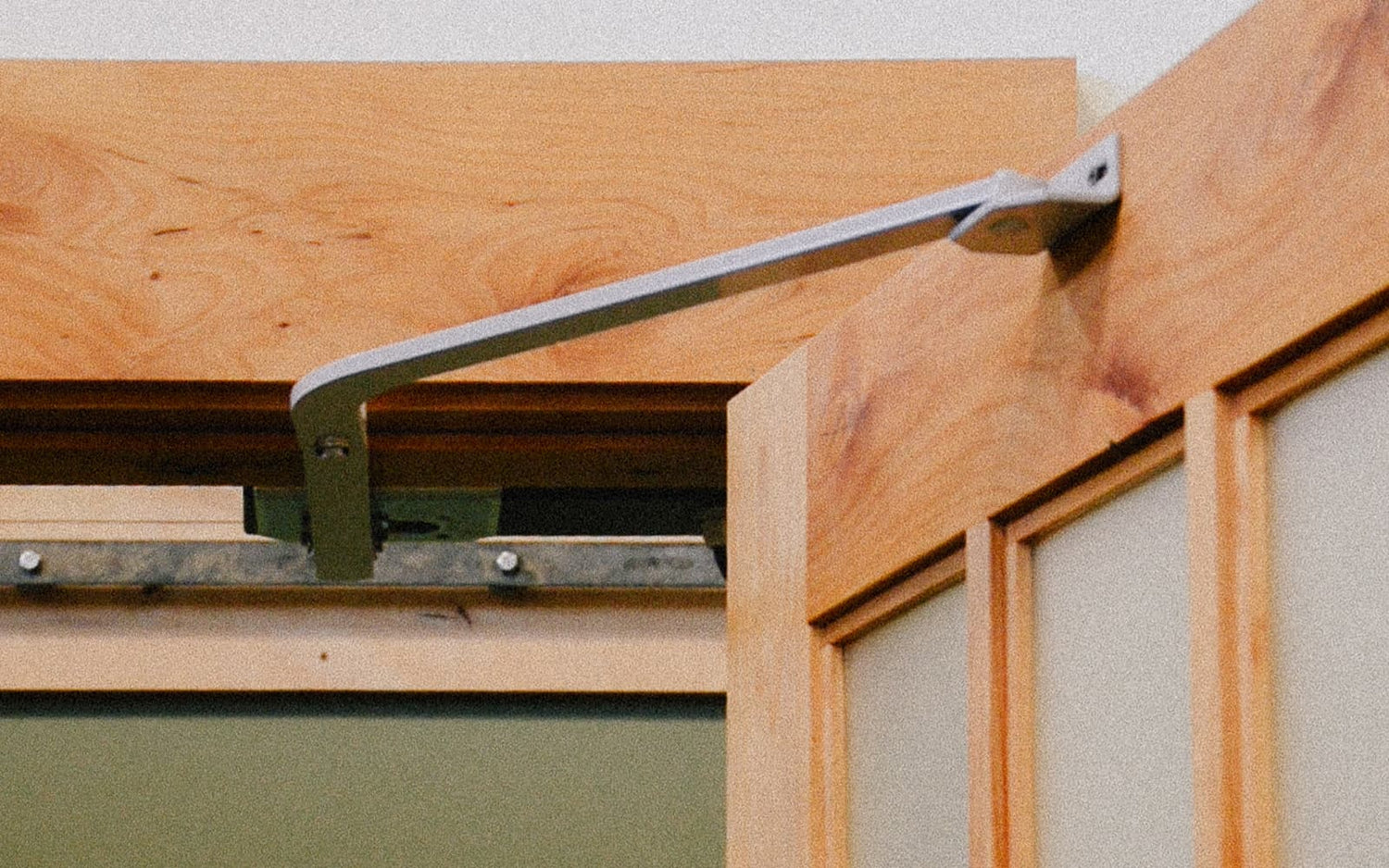 Open carriage door leaf with the Franklin Garage Door Opener