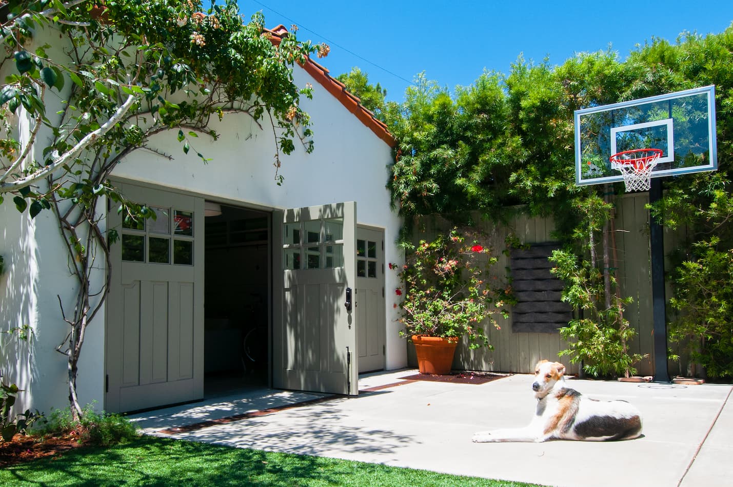 Open Green Carriage Style Garage Door on a Patio area