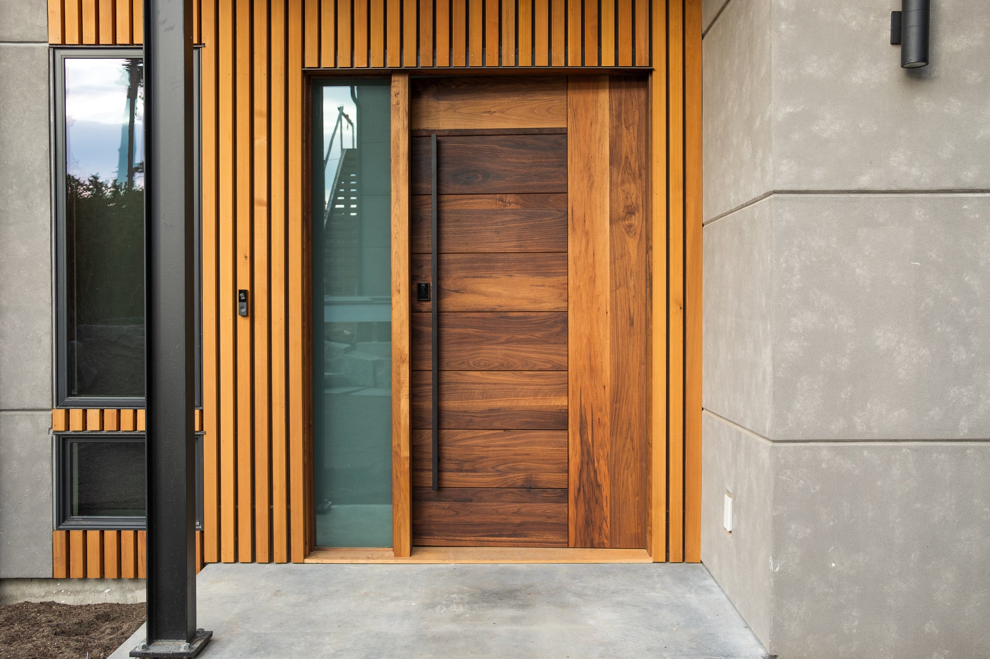 Peninsula door with frosted glass sidelight on modern home