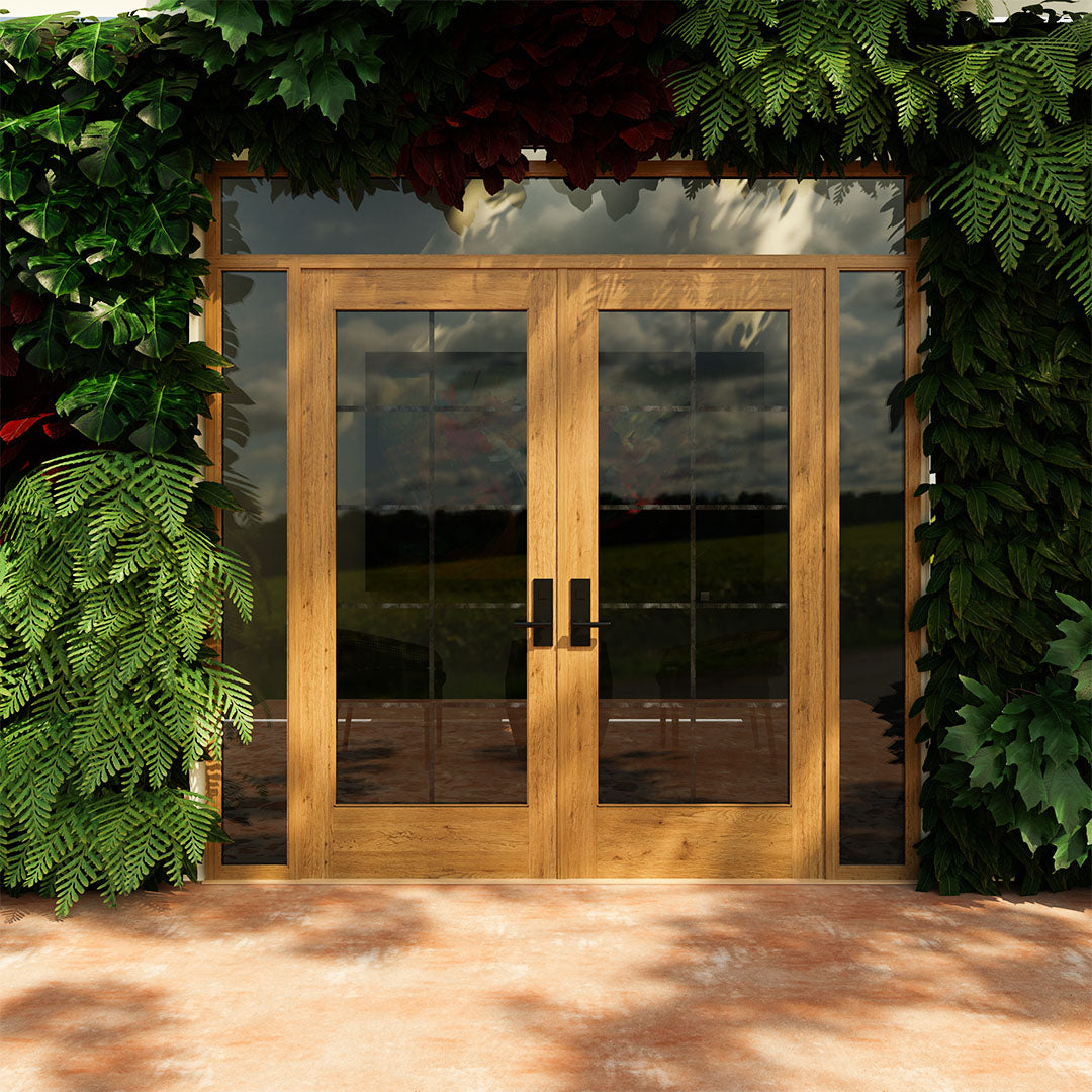 Front view of a White Oak Full Panel French Glass Exterior Double Doors next to a plant wall