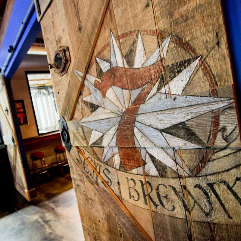reclaimed wood barn door with a logo