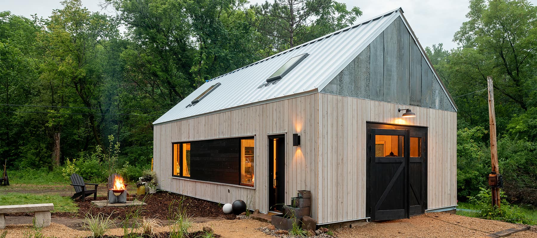 Black Carriage Door installed on a woodshop shed