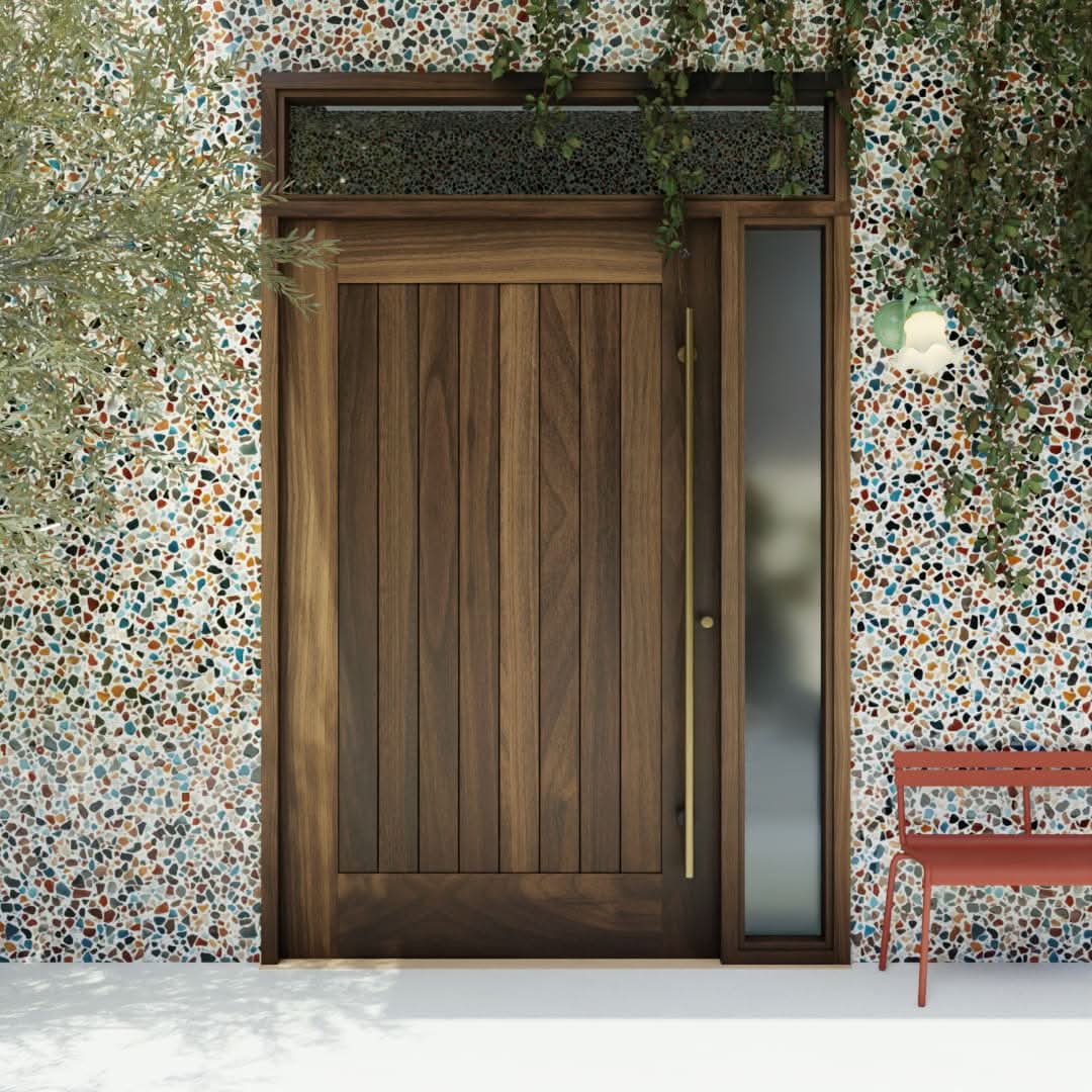 Monterey Single Panel Tongue and Groove Pivot Door with sidelights and transom and a long brass handle in a colorful garden wall
