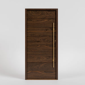 Pacifica Horizontal Plank Modern Entrance Door by RealCaft in walnut wood with a jamb, threshold, and brass long pull handle in a white background