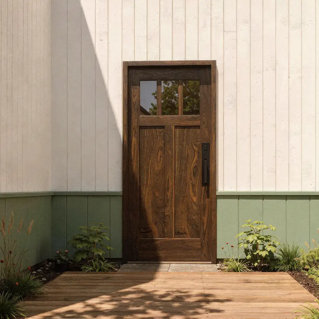 Wooden front door on a building with a wooden deck and plants