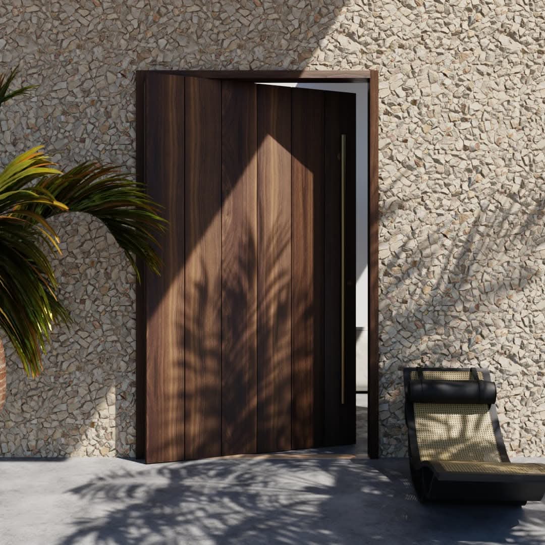Open True Plank Pivot Door in a stone wall next to a black lounge chair