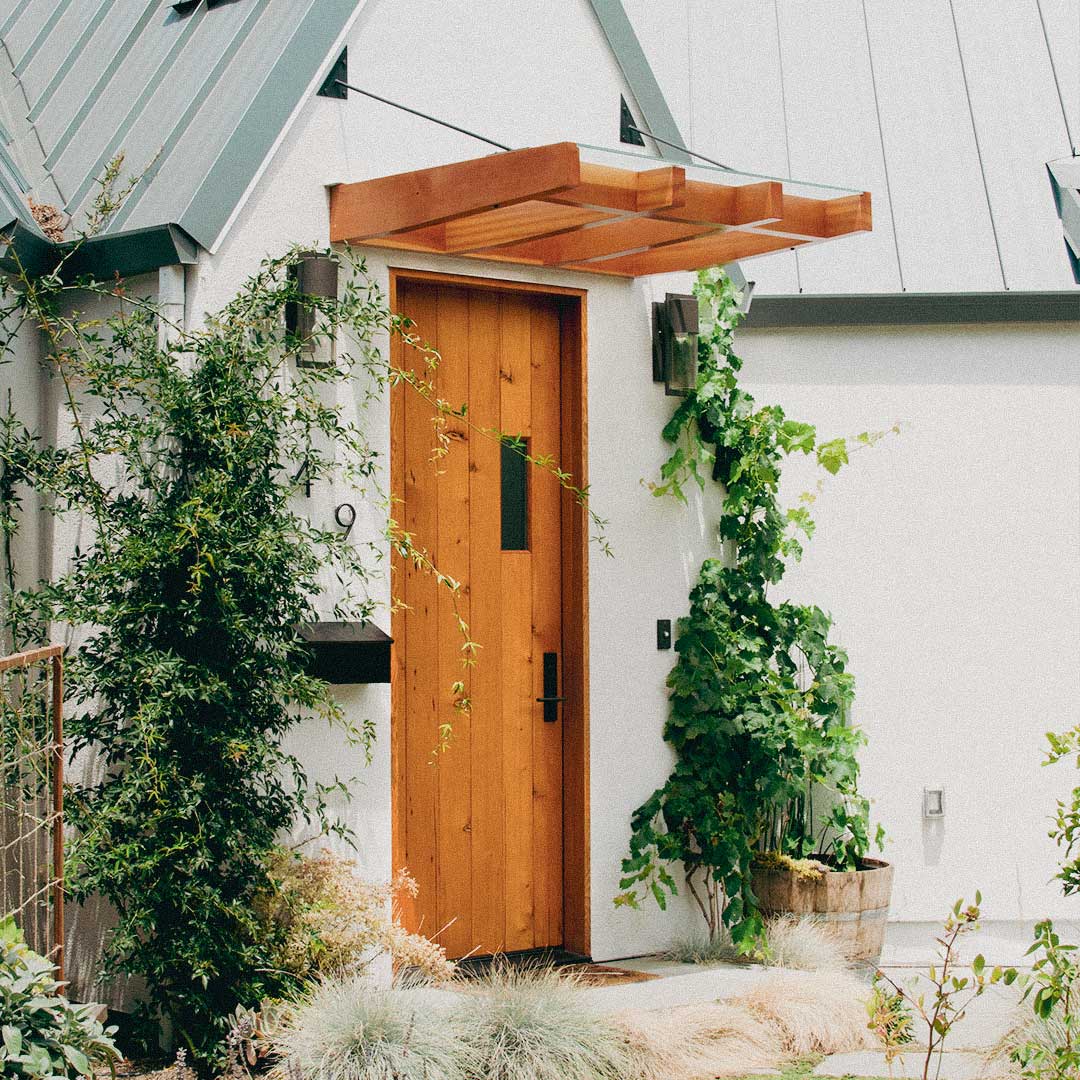 custom wood door on white facade