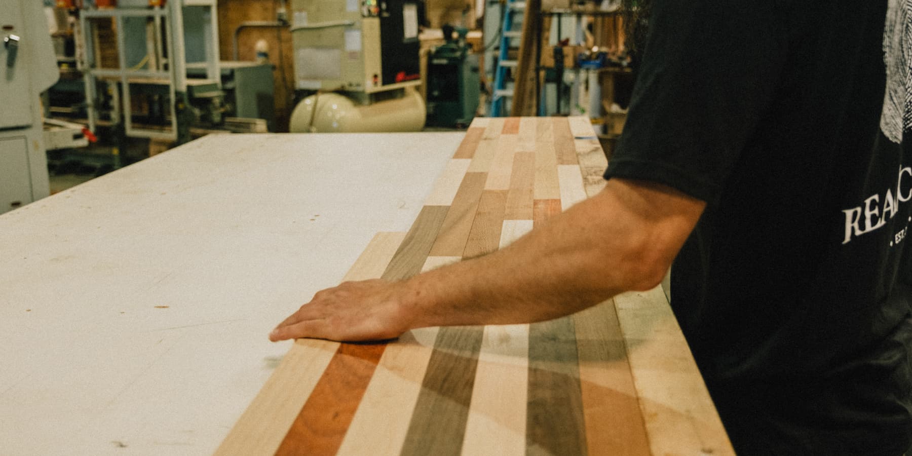 Craftsman test-fits cut pieces of face grain countertop