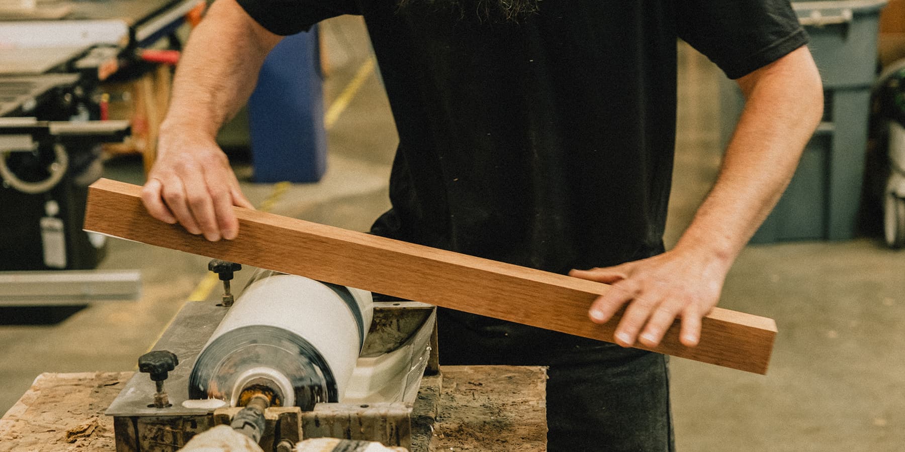 Craftsman applies glue to a plank for palomino countertop