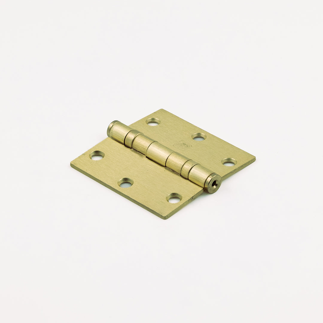 Brass hinge on a white background
