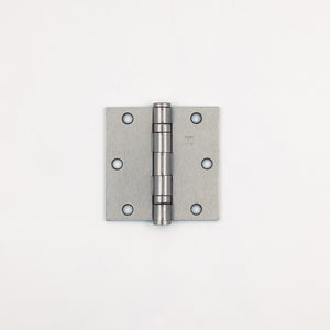 Metallic door hinge on a white background