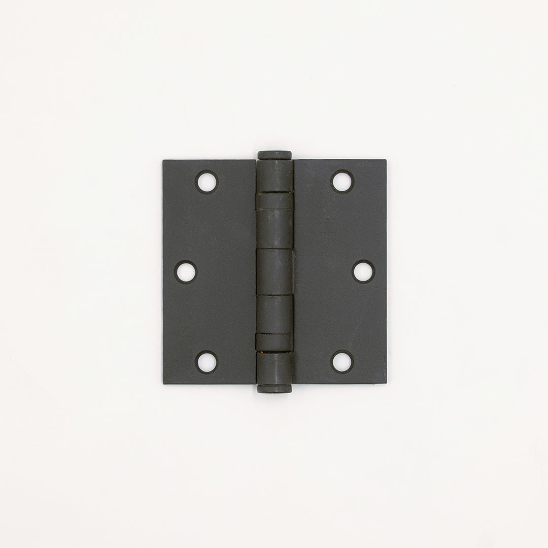Black metal hinge on a white background
