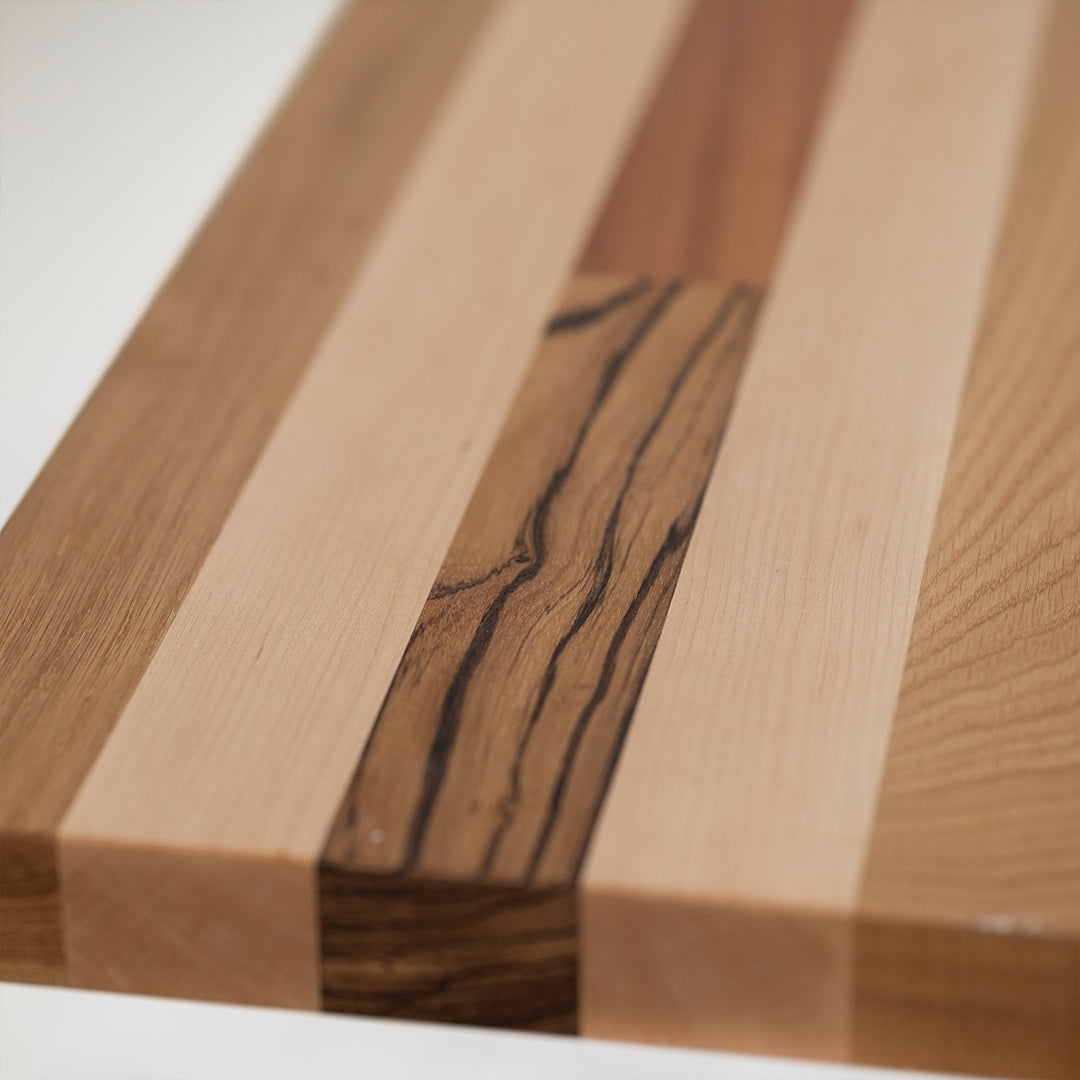 closeup of Palomino countertop with Zebrawood, Maple, and Black Walnut