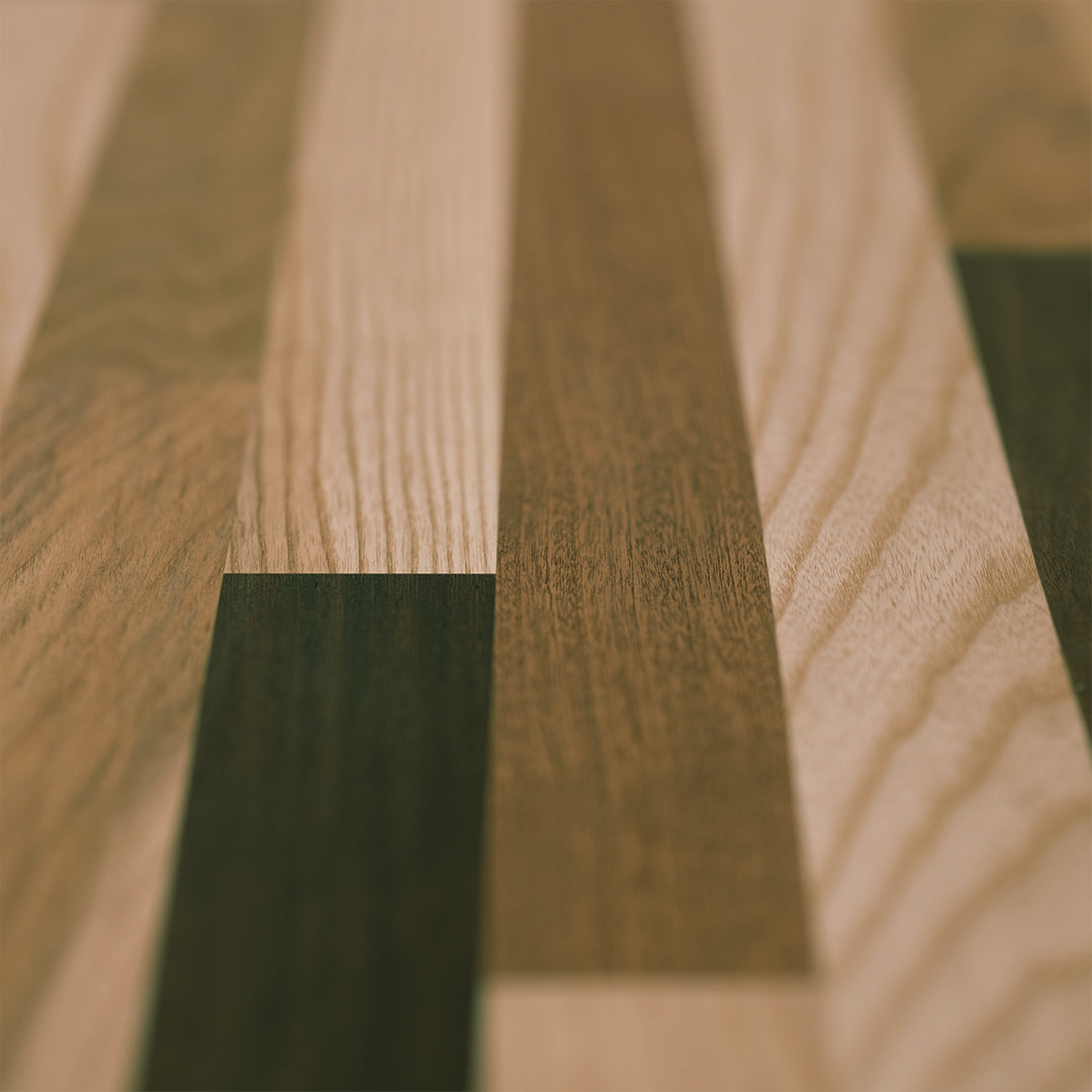 Red Roan countertop closeup featuring Walnut, Padauk, and Ash pieces