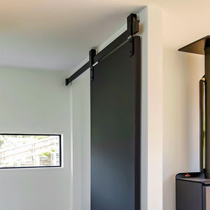 Cavity Sliders Barn Door Track at RealCraft. hardware system installed on a black door