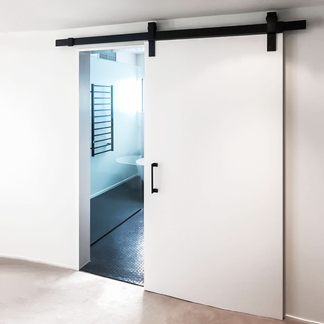 Cavity Sliders Barn Door Track at RealCraft. Hardware system installed on a white door