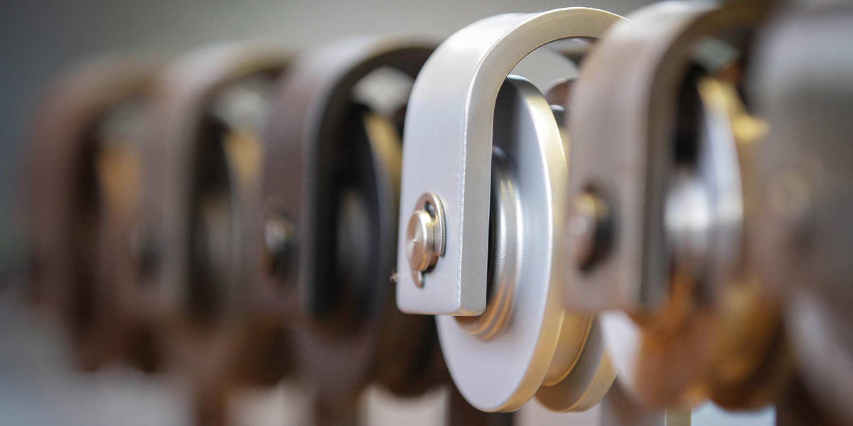 Close-up shot of barn door hardware hangers.
