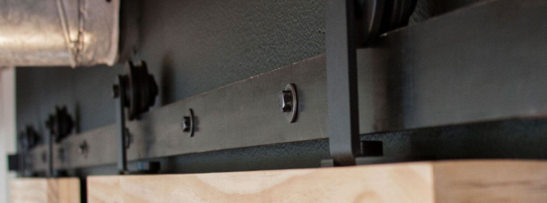 Black Aero Sliding Hardware on bi-parting barn door operation