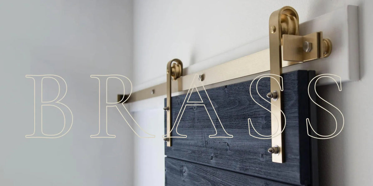 Solid Brass Sliding Barn Door hardware installed on a blue barn door