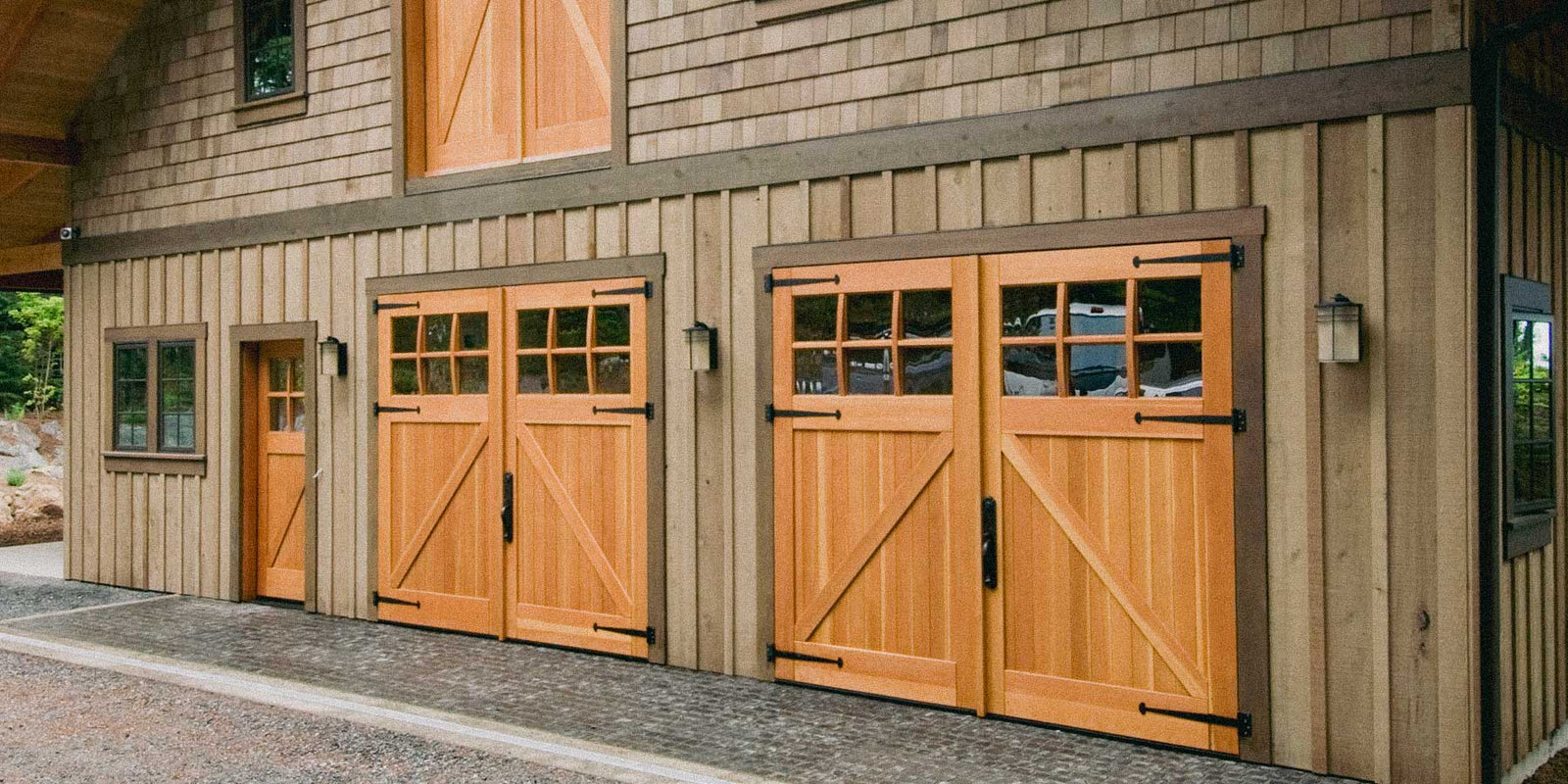 Two sets of wood carriage doors on a barn