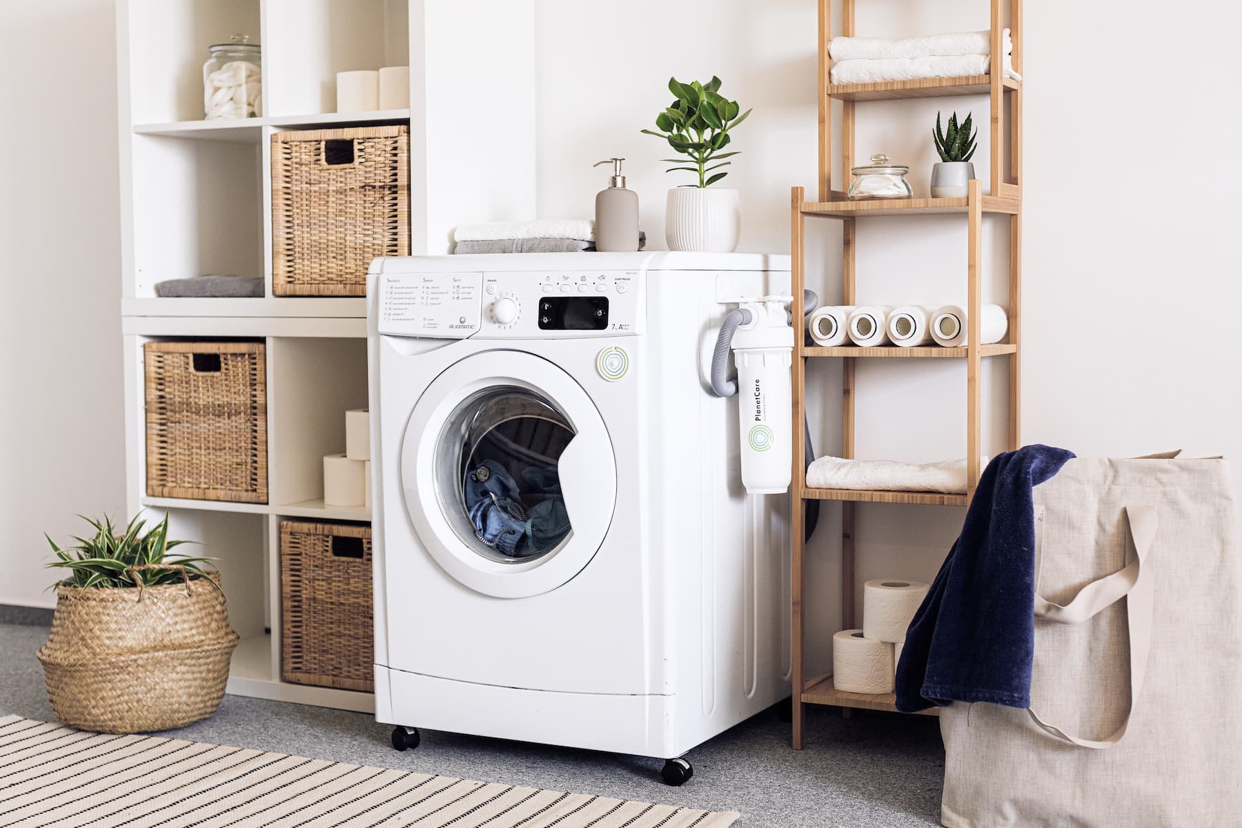 Boho Laundry Room with a white washer and shelves