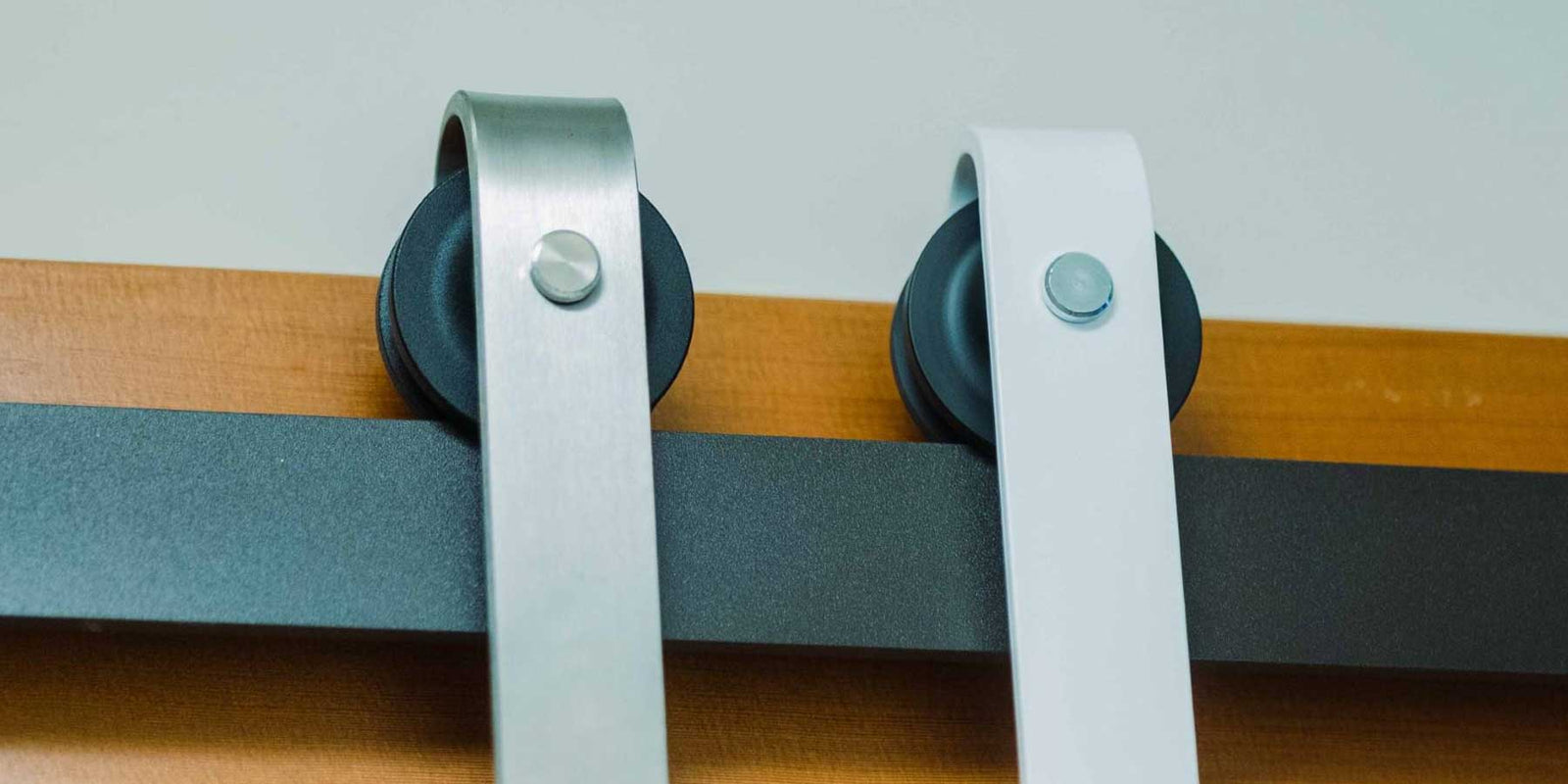 Stainless Steel, white, and black barn door hardware kit.