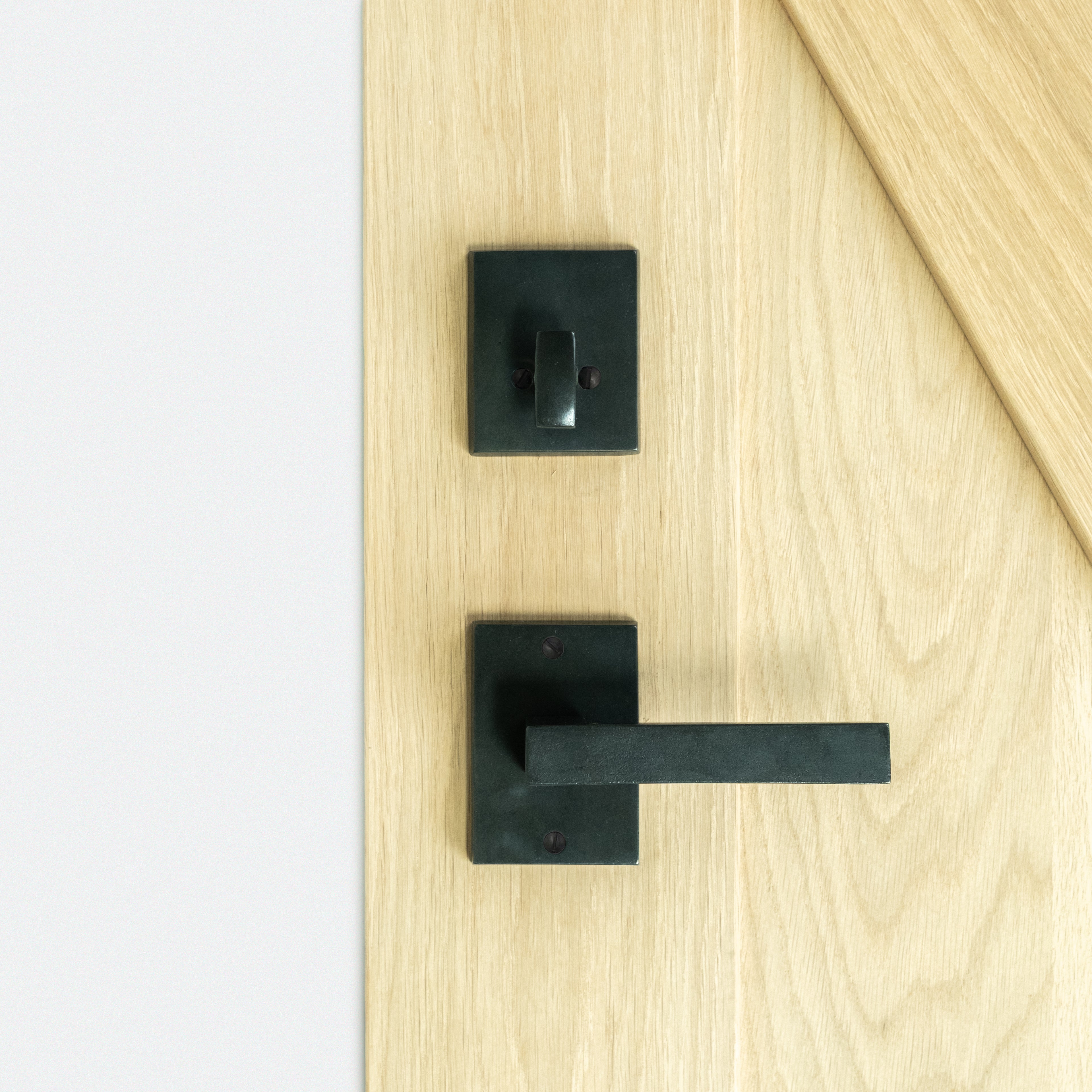 closeup of interior bronze passage handle in Dark Bronze