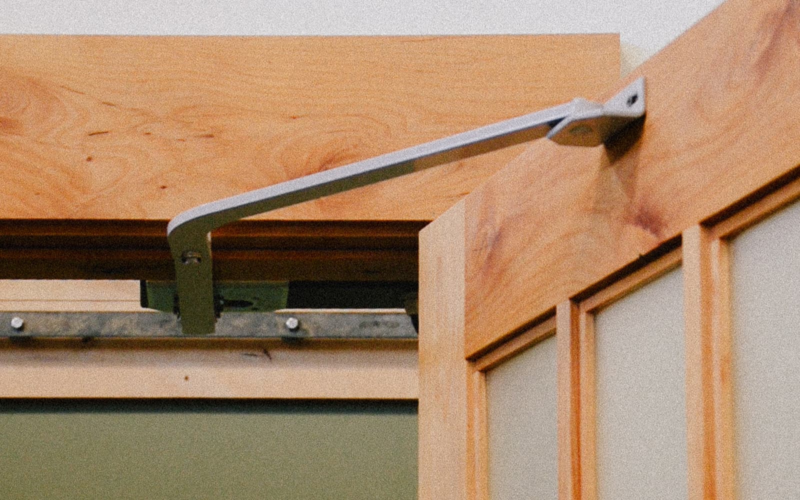 Open carriage door leaf with the Franklin Garage Door Opener