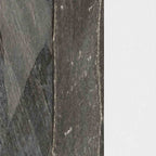 Close-up of a textured hardware finish: galvanized, blacksmith, and white