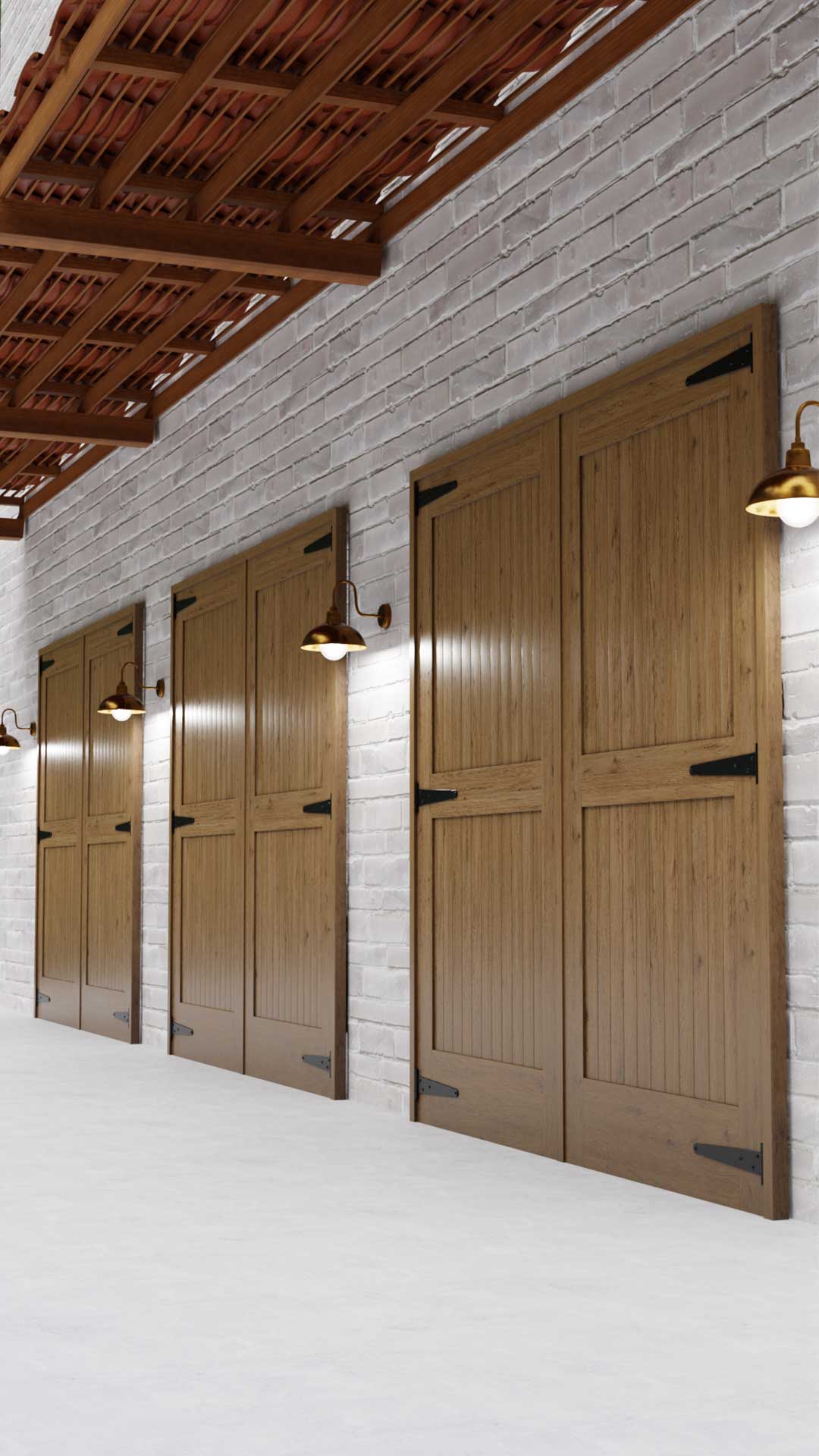 three outswing carriage style garage doors in a white brick wall