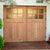 Simple Carriage Door installed in a garden area. Carriage Doors have custom textured glass.