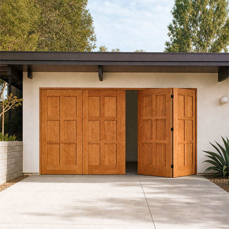 Wooden garage doors on a modern house with trees in the background