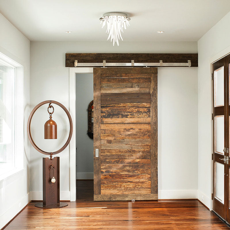 reclaimed wood door with box rail hardware on living room