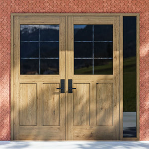 White Oak Half Glass French Double Doors with right sidelight on a red brick wall