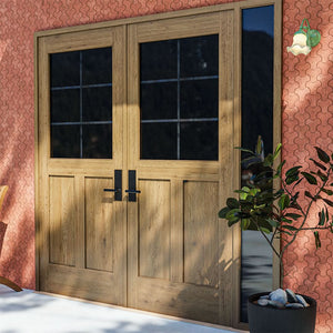 White Oak Half Glass French Double Doors with right sidelight on a red brick wall next to a potted plant and a wall lamp