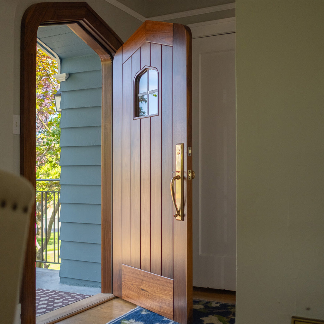 Modern Point Arch walnut door with brass hardware