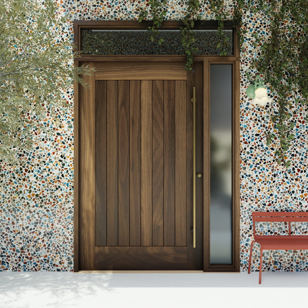 Monterey Single Panel Tongue and Groove  Pivot Door with sidelights and transom and a long brass handle in a colorful garden wall