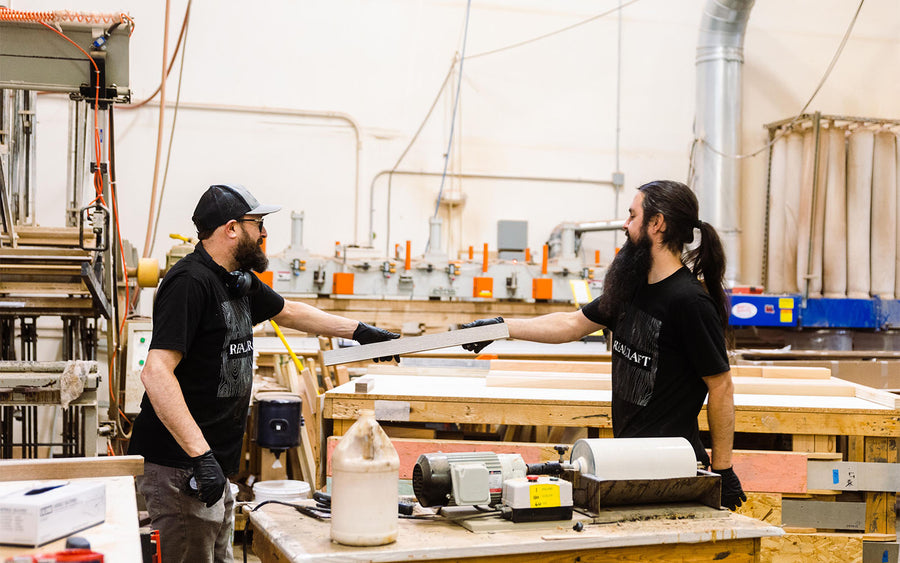 Craftsman working together gluing countertop