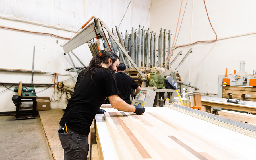Craftsman selects wood pieces for countertop