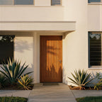 Modern house with a San Simeon wooden door and cacti in front