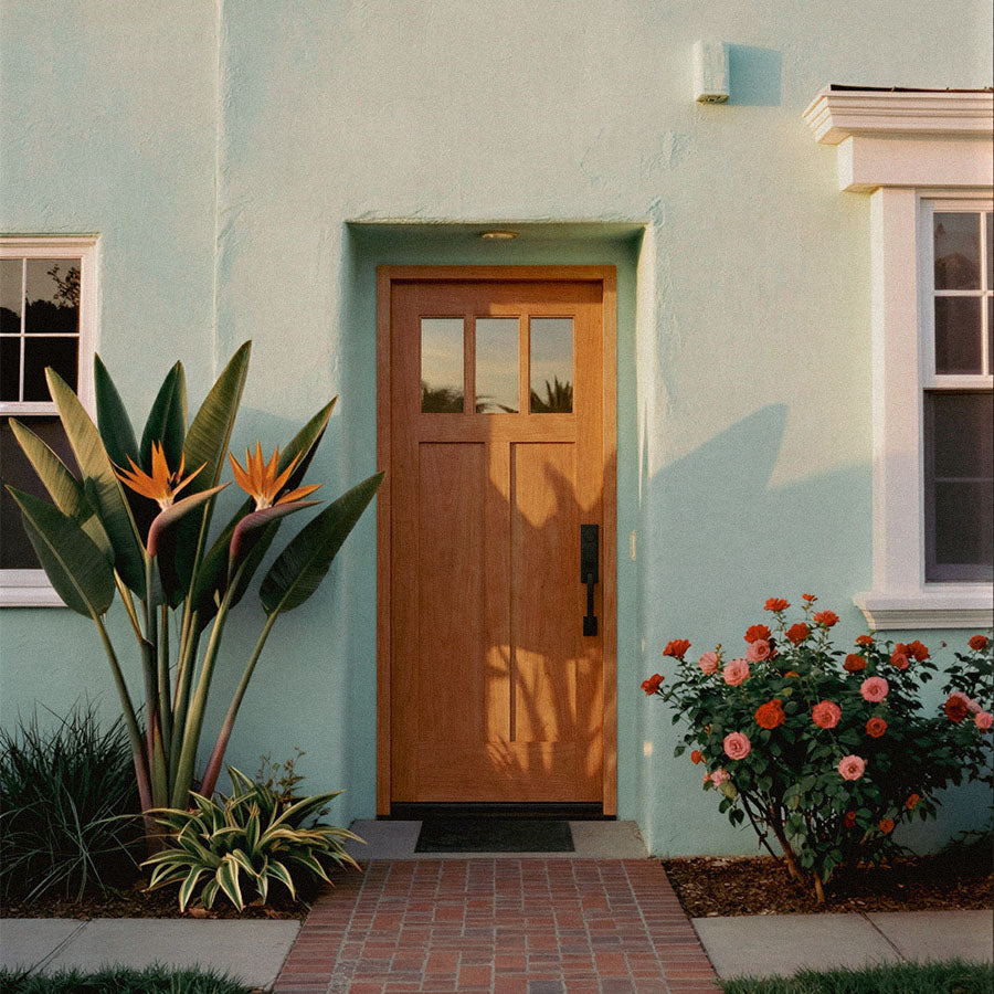 Savona Wood Front door of a house with plants and flowers on either side