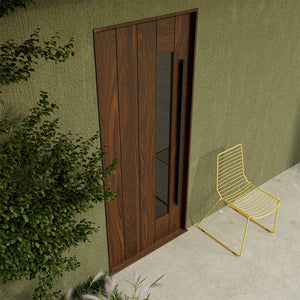 Custom Carmel Modern front door in solid walnut with side window insert, highlighting natural wood grain and minimalist entry design.