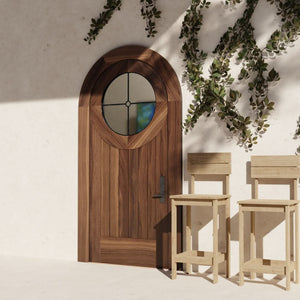 Round Window Door with Leaded Glass with matching casing in Black Walnut on a modern home with climbing vines