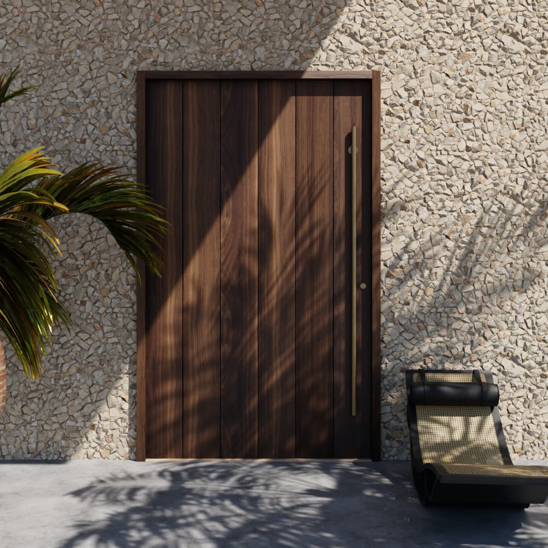Closed True Plank Pivot Door in a stone wall next to a black lounge chair