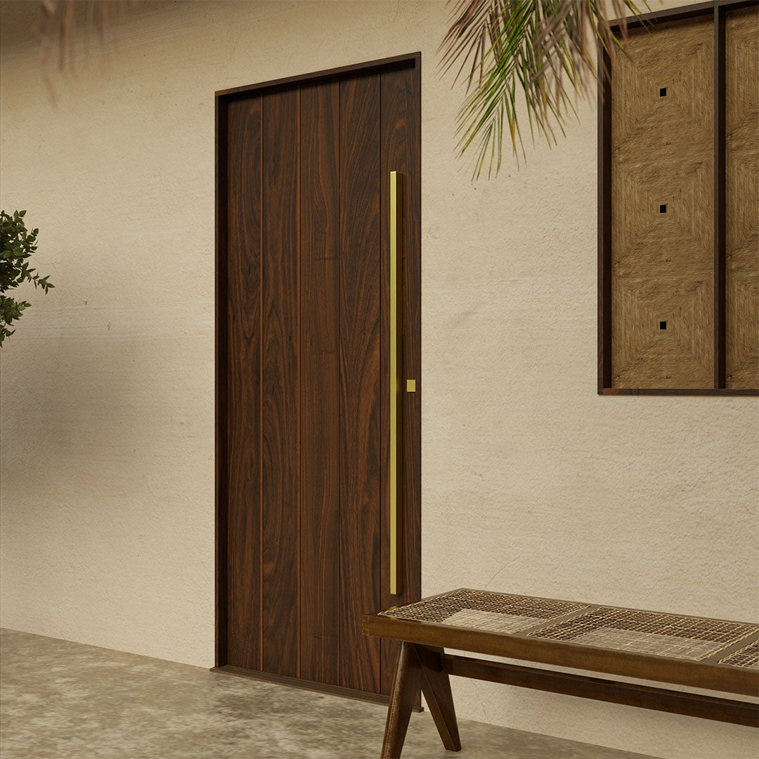 Custom modern walnut entry door featuring vertical planks and minimalist brass handle, designed for luxury curb appeal.