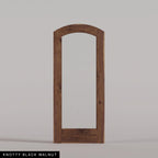 Amalfi arched door in Knotty Black Walnut, with a single full-height glass panel. Labeled wood species view.