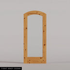 Amalfi arched door in Tight Knot Cedar, with a single full-height glass panel. Labeled wood species view.